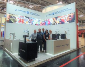 A modern and visually striking Rotarex Solutions booth at Drinktec 2022, showcasing innovative technologies for the beverage industry