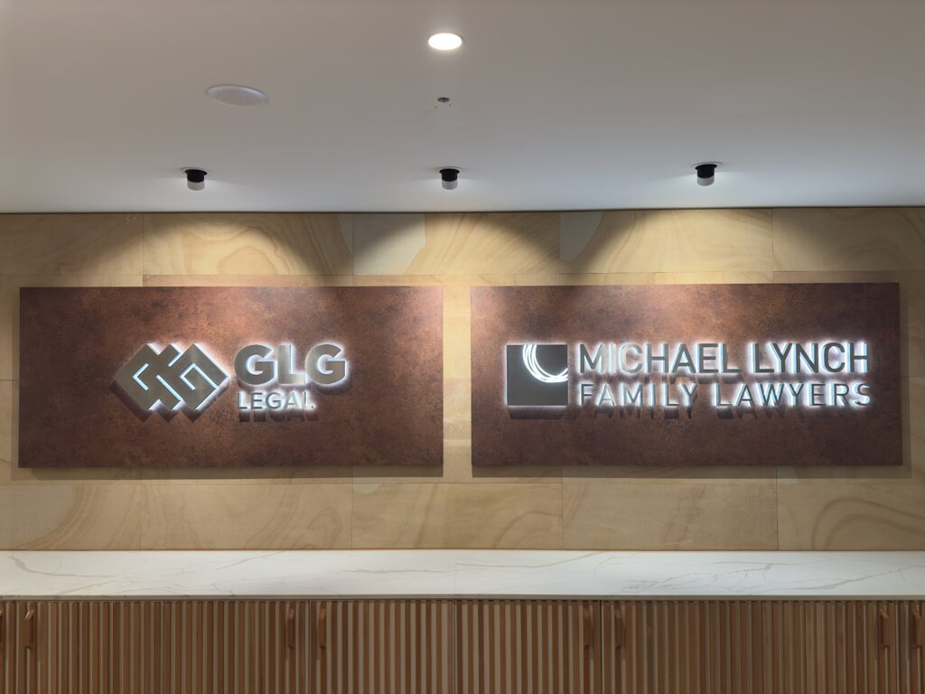 Lobby signs displaying the names ‘GLG Legal’ and ‘Michael Lynch Family Lawyers,’ representing a professional legal workplace.