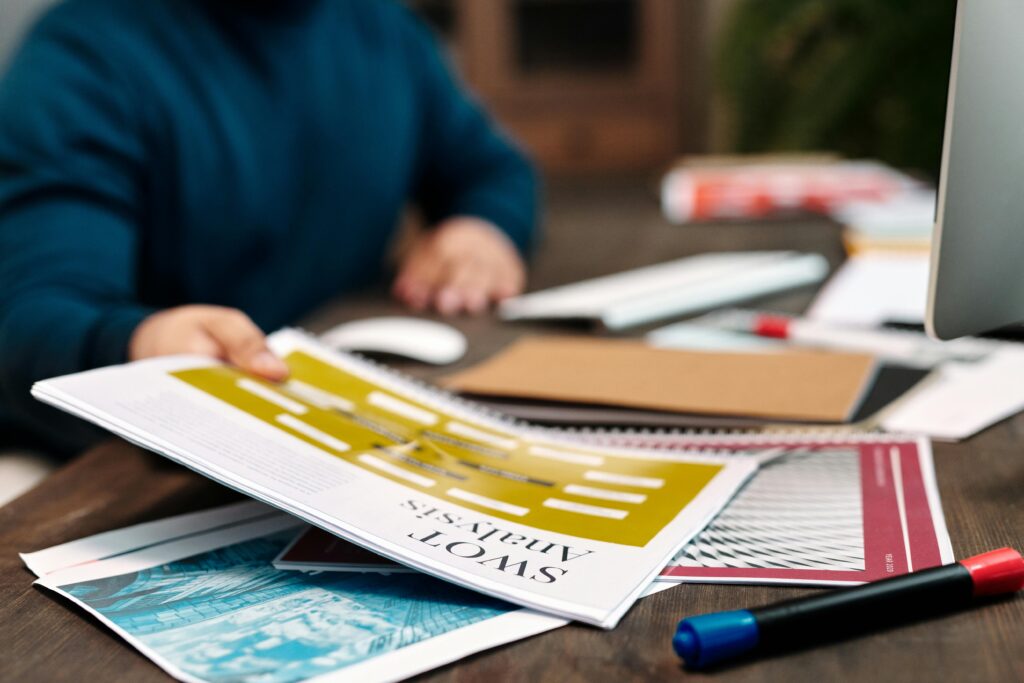 A set of documents labeled ‘SWOT Analysis,’ symbolizing strategic business planning and evaluation